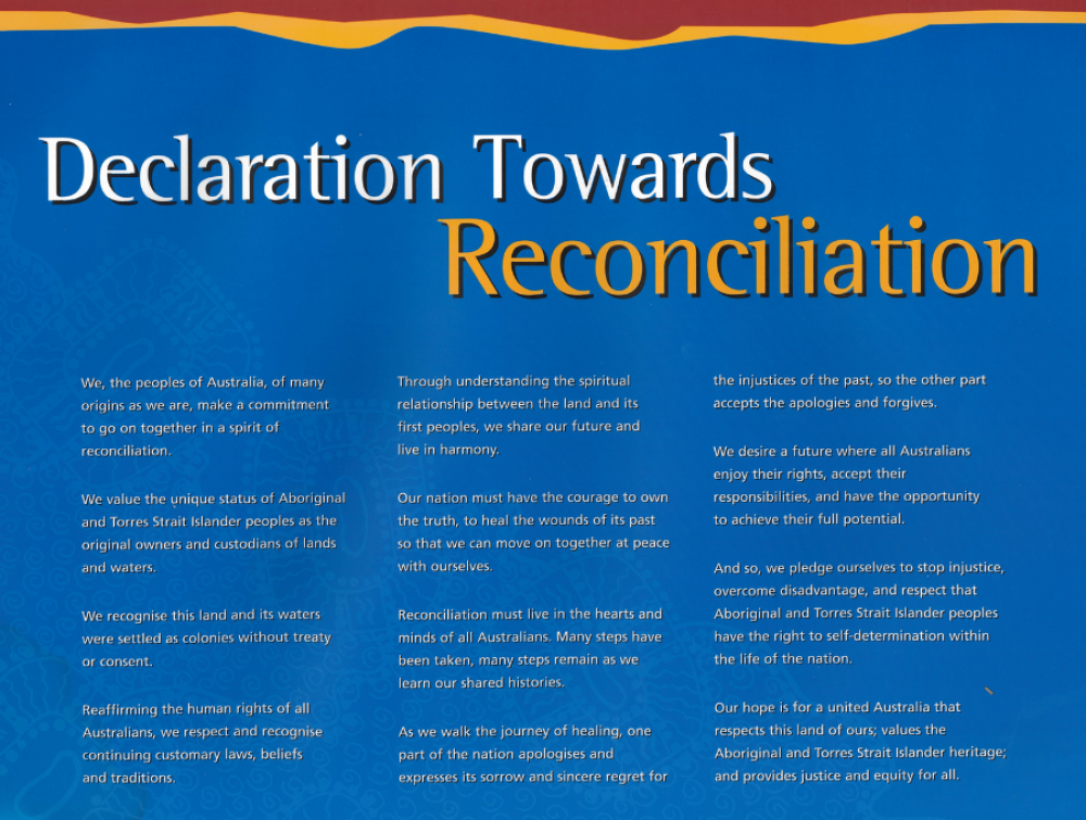 Declaration Towards Reconciliation 900×680 feature image An image of the text of the Australian Declaration Towards Reconciliation. White and yellow text on a dark blue background, with Indigenous artwork overlay, and strips of red and yellow at the top.